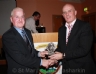 Club Treasurer John Mc Auley presents Football Guest Liam Bradley an award